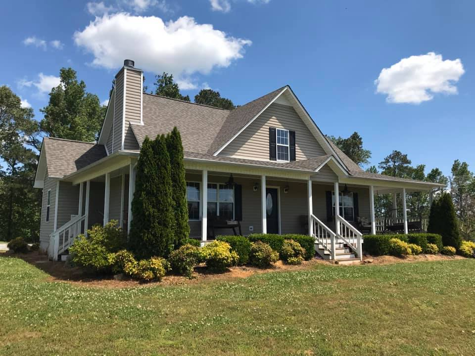 Beige home with renovated roof