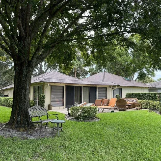 A house with a bench in front of it
