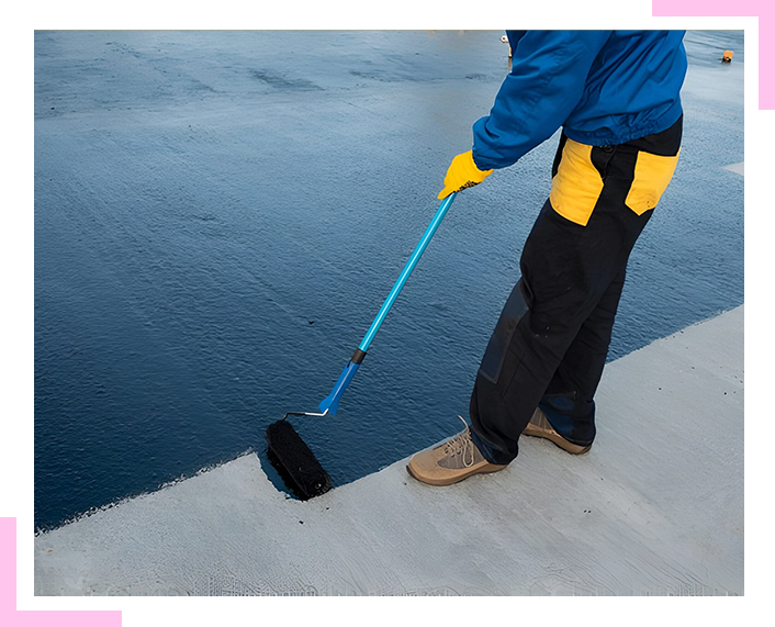 A person is painting a concrete surface with a roller.