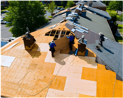 A group of men are working on a roof.