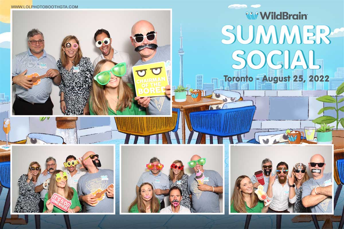 A group of people are posing for a picture in a photo booth.