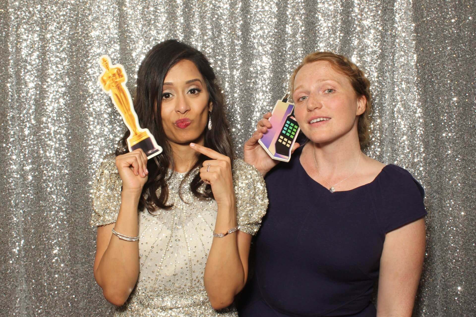 Photo booth rental in Toronto for an event. Posing in front of a beautiful silver sequin glitter backdrop offered by LOL Photo Booth. Tags: Event planning ideas, Photo booth prints, high resolution photos, Toronto photo booth rental services. GIFS, Boomerangs, Mosaic Walls, Slow motion, brand activation.
