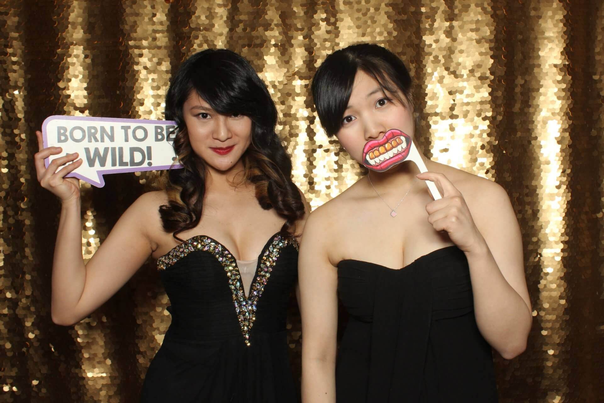 Photo booth rental in Toronto for an event. Posing in front of a beautiful gold scale backdrop offered by LOL Photo Booth. Tags: Event planning ideas, Photo booth prints, high resolution photos, Toronto photo booth rental services. GIFS, Boomerangs, Mosaic Walls, Slow motion, brand activation.