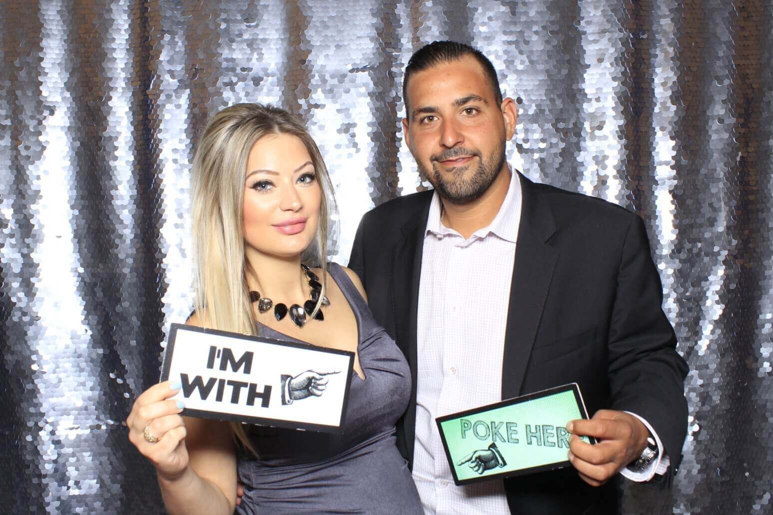 Photo booth rental in Toronto for an event. Posing in front of a beautiful silver scale backdrop offered by LOL Photo Booth. Tags: Event planning ideas, Photo booth prints, high resolution photos, Toronto photo booth rental services. GIFS, Boomerangs, Mosaic Walls, Slow motion, brand activation.