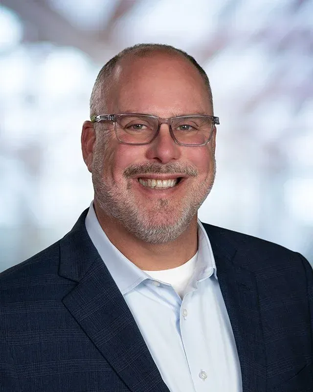 A large building with balconies and hanging potted plants
