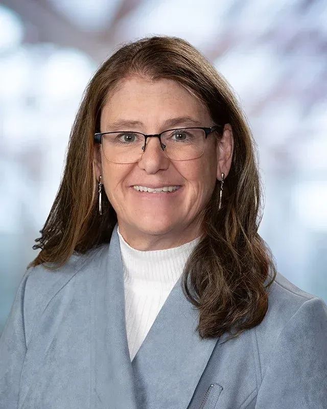 A large building with balconies and hanging potted plants