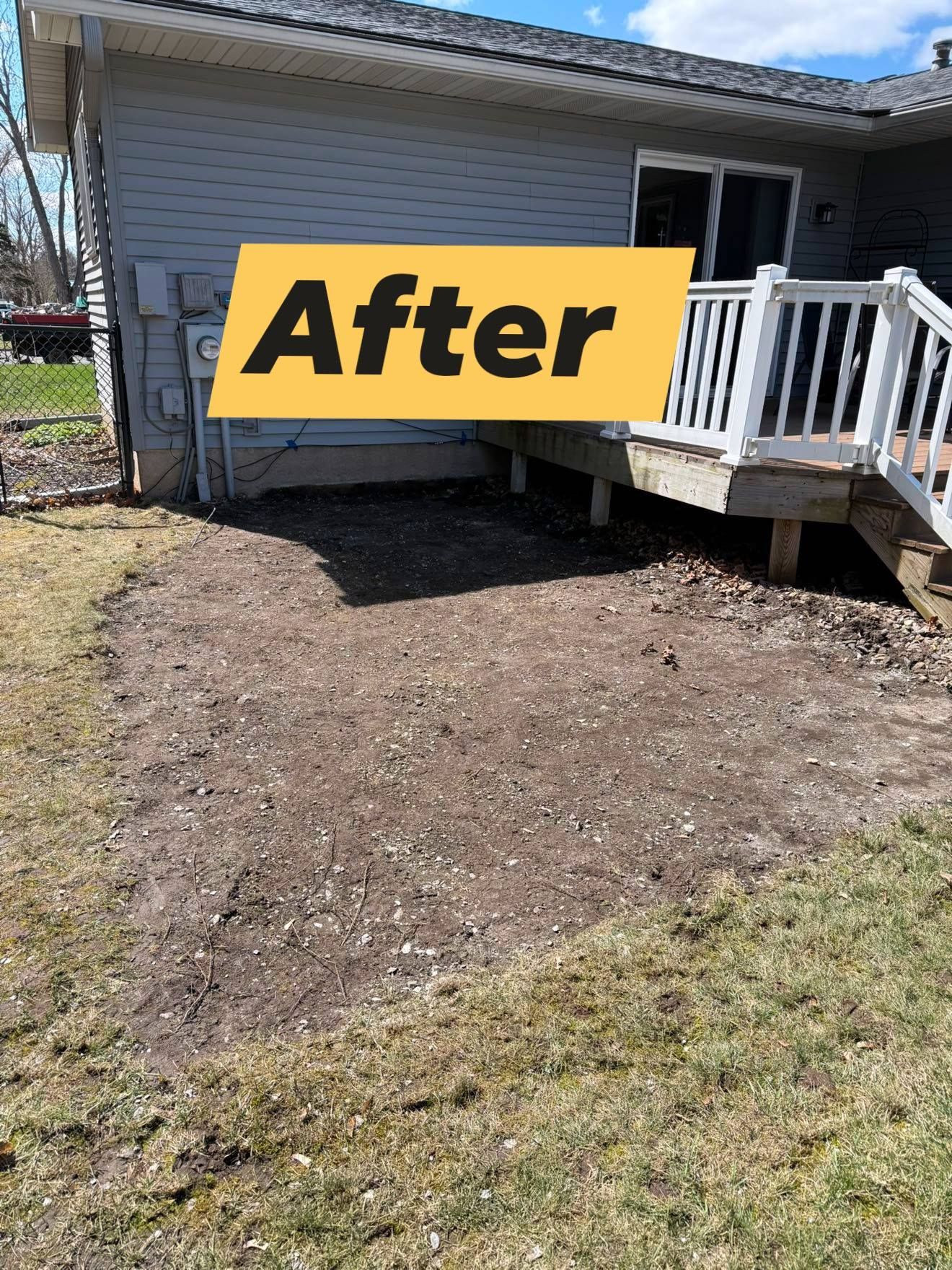 Cleared earth area next to a deck, labeled 