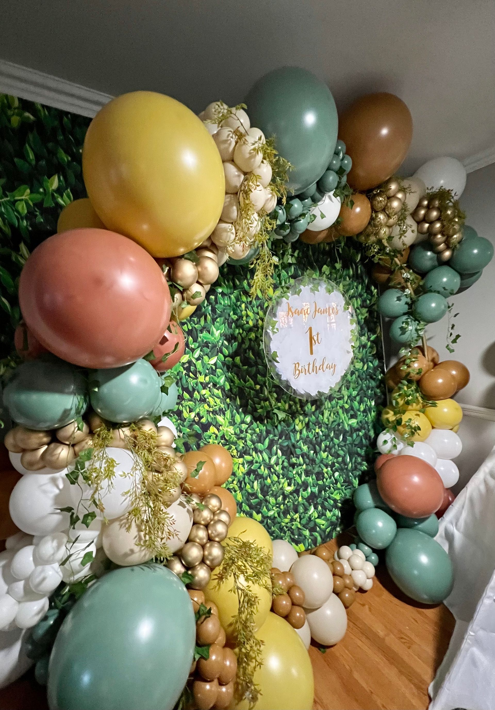 A bunch of balloons are sitting on the floor in a room.