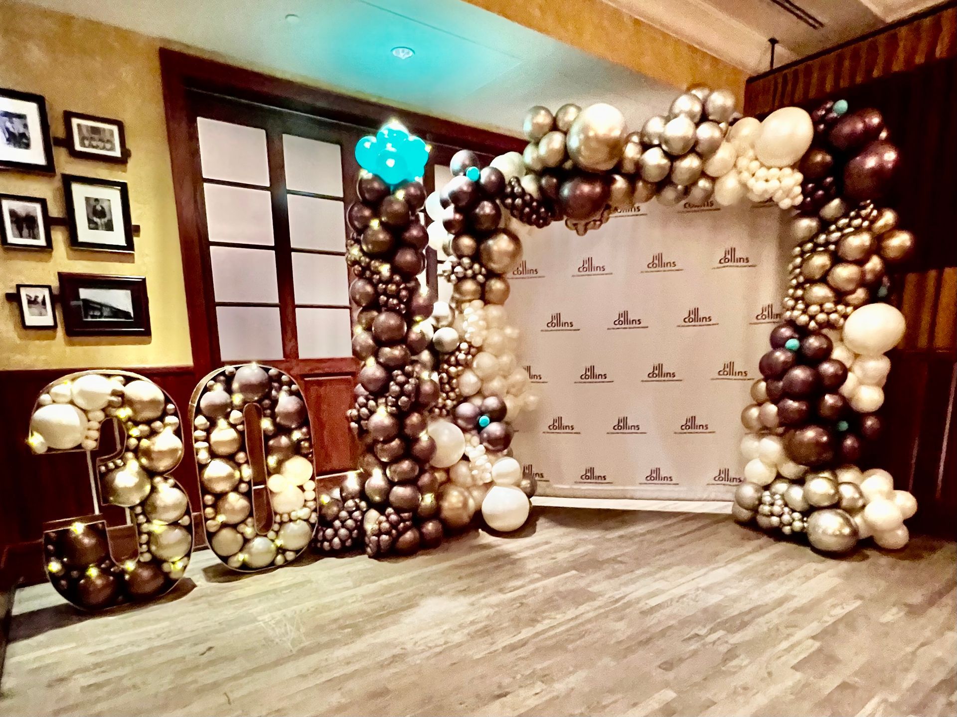 A room filled with balloons and a sign that says ' i love you ' on it.