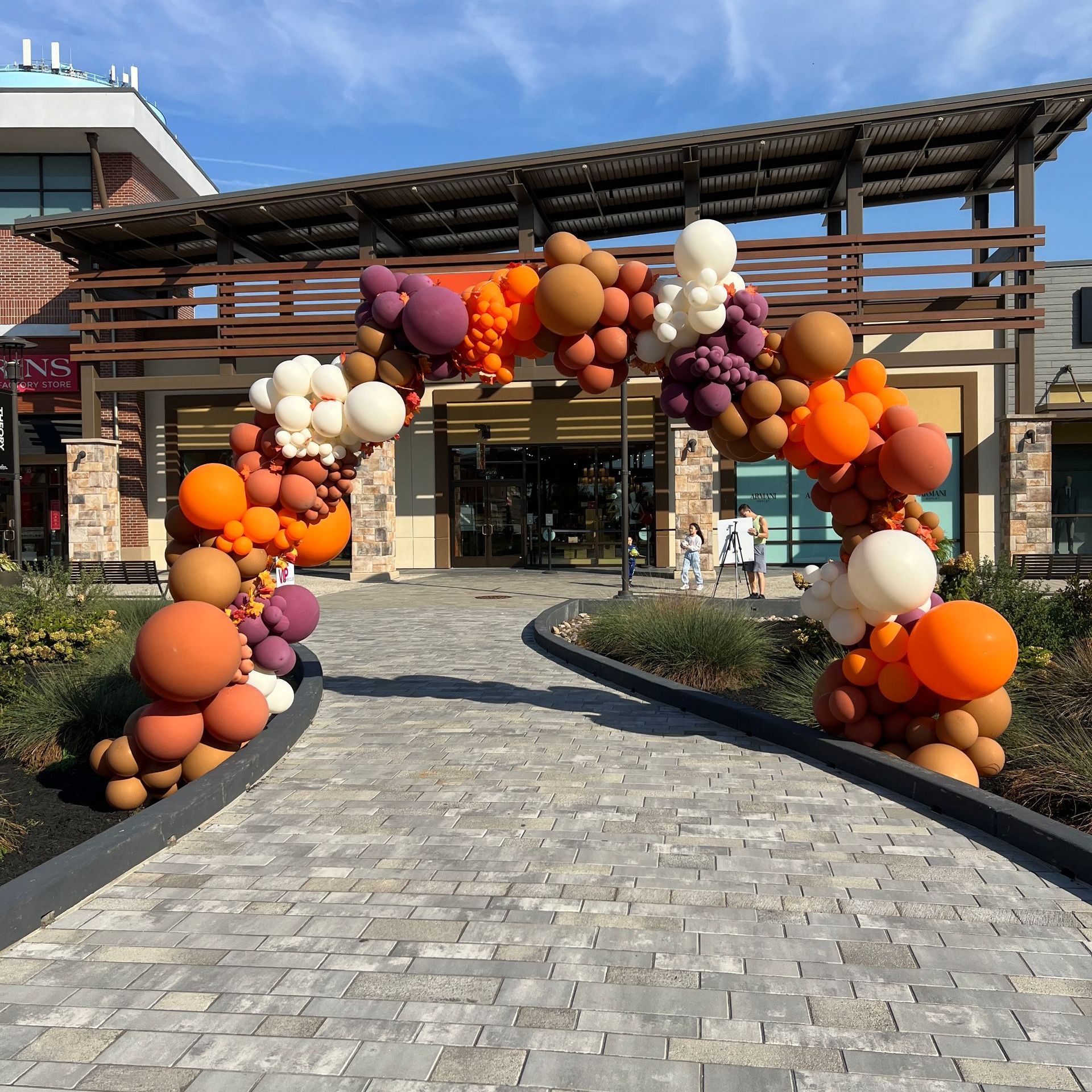 Fall themed balloon garland, in brown and shades of orange.
