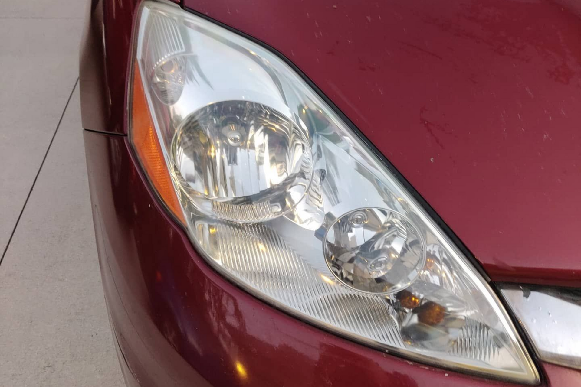 Audi SQ5 SUV engine bay with hood open; silver, black, and red components.