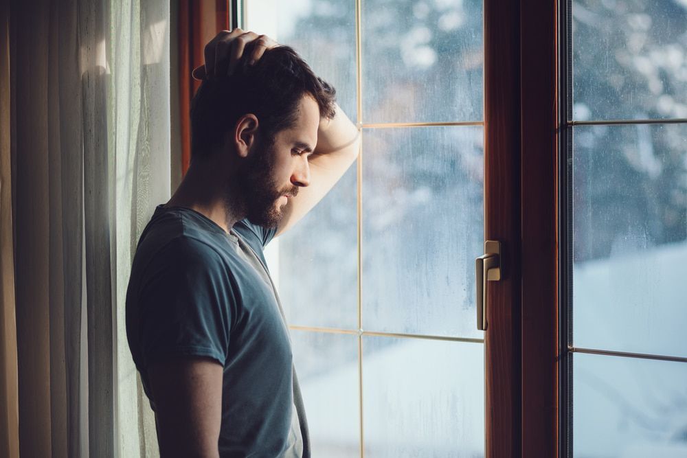 Man Standing In Front Of A Window — Tony Talks in Redcliffe, QLD