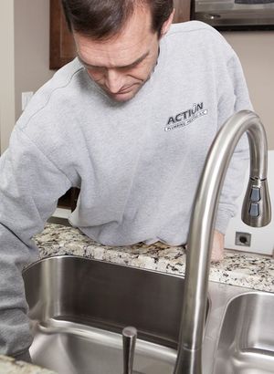 Man Checking the Faucet - Faucet Repair in Rochester, MN