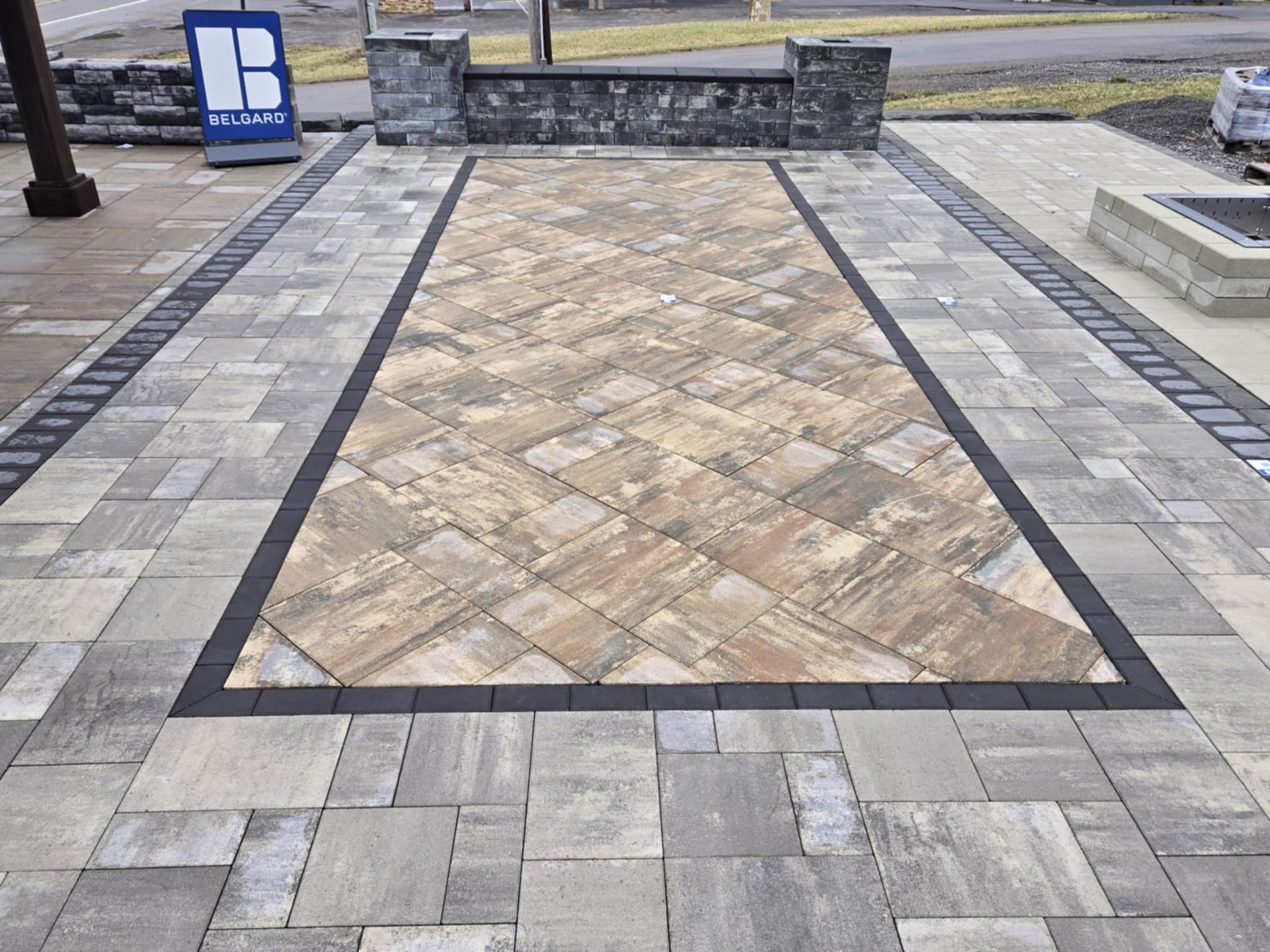 A brick walkway with a sign that says b on it