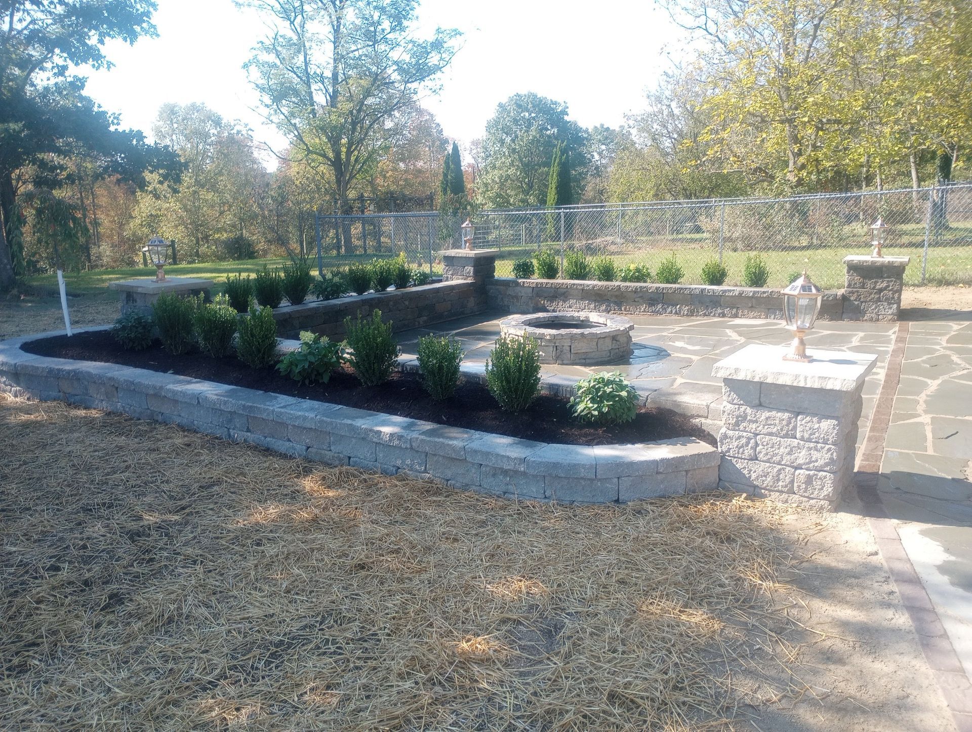 There is a fire pit in the middle of the yard.