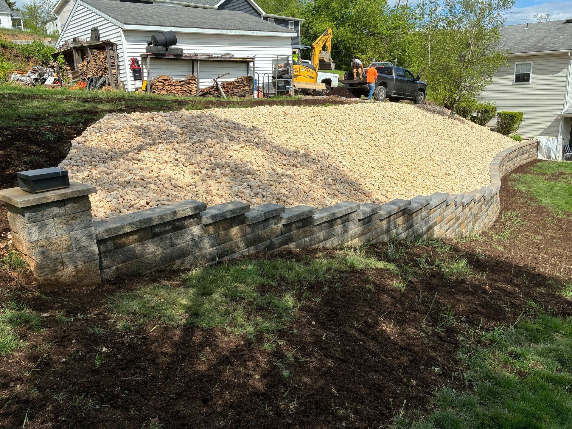 A large pile of dirt is sitting in front of a house.
