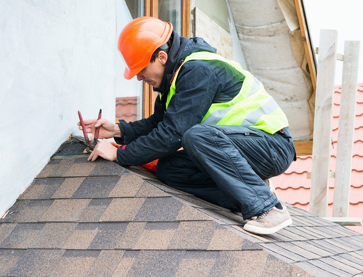 Man Repairing Roof Shingles – Elida, OH – Lawson Brothers Construction