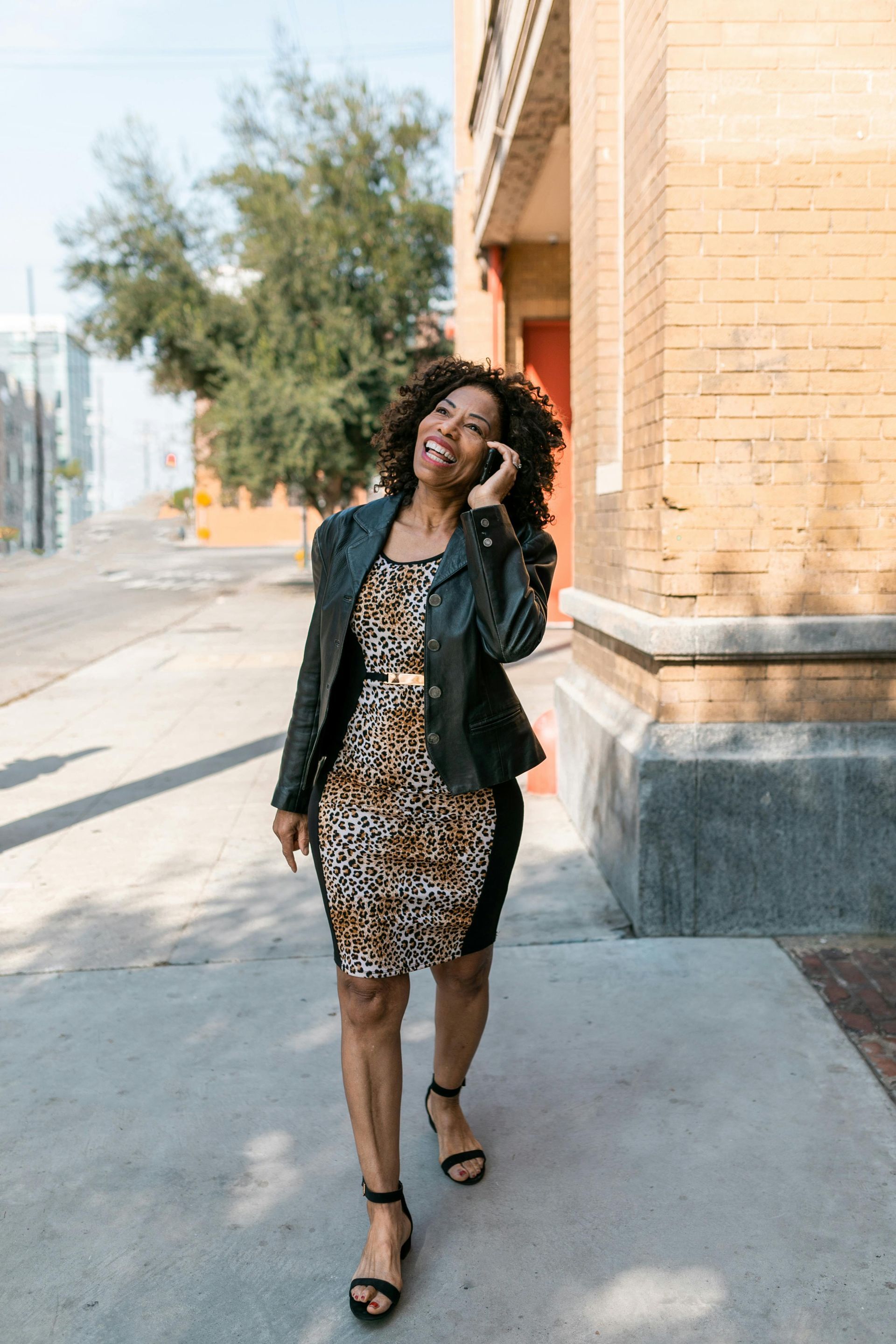 Red brick building with slate roof and dormers.