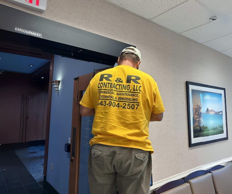 A person wearing a yellow shirt with 