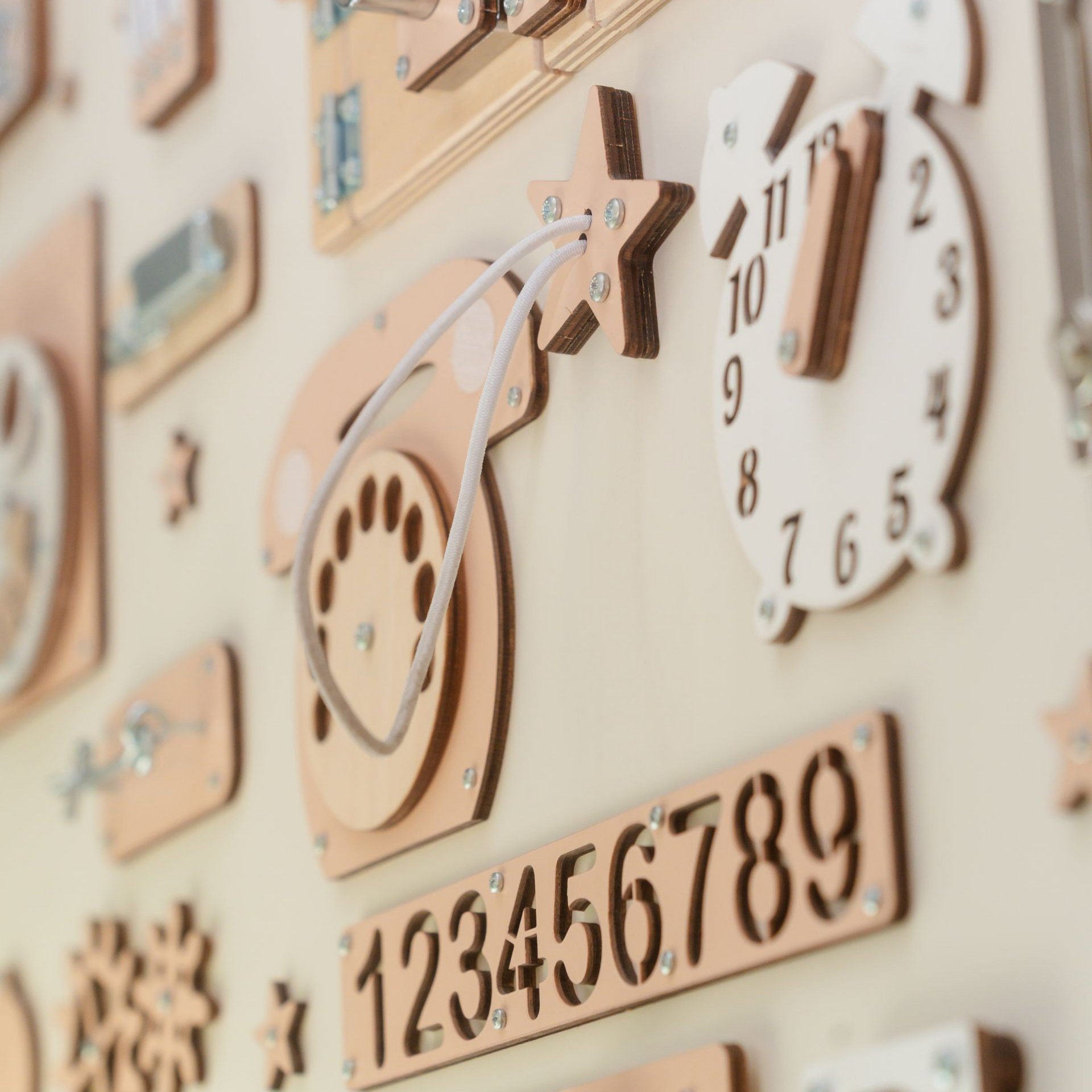 Wooden activity board with clock, numbers, and phone features.