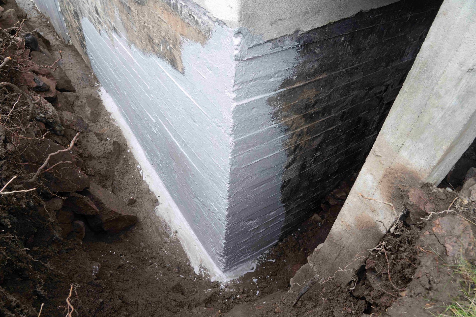 Exterior waterproofing of concrete basement walls to repair leaky basement