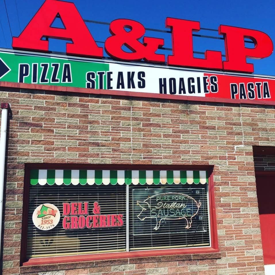 A brick building with a sign that says a & lp