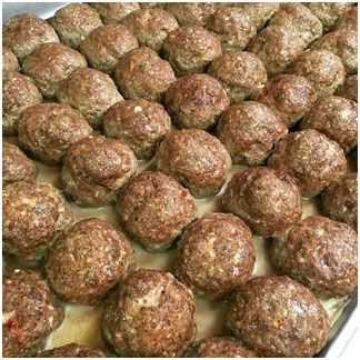 A bunch of meatballs are sitting on top of each other on a plate