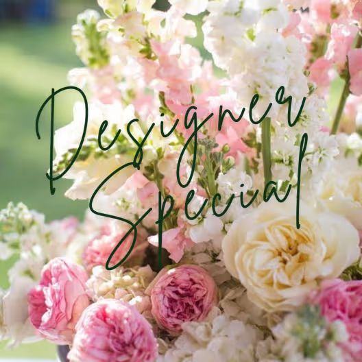 A close-up of a lush bouquet of pink and white flowers with 