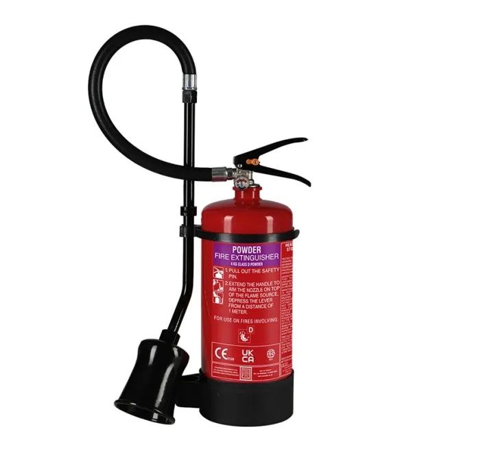 Class D A red fire extinguisher with a black hose attached to it
