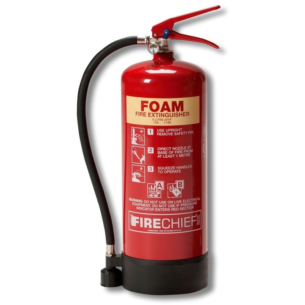 Class B A red foam fire extinguisher on a white background