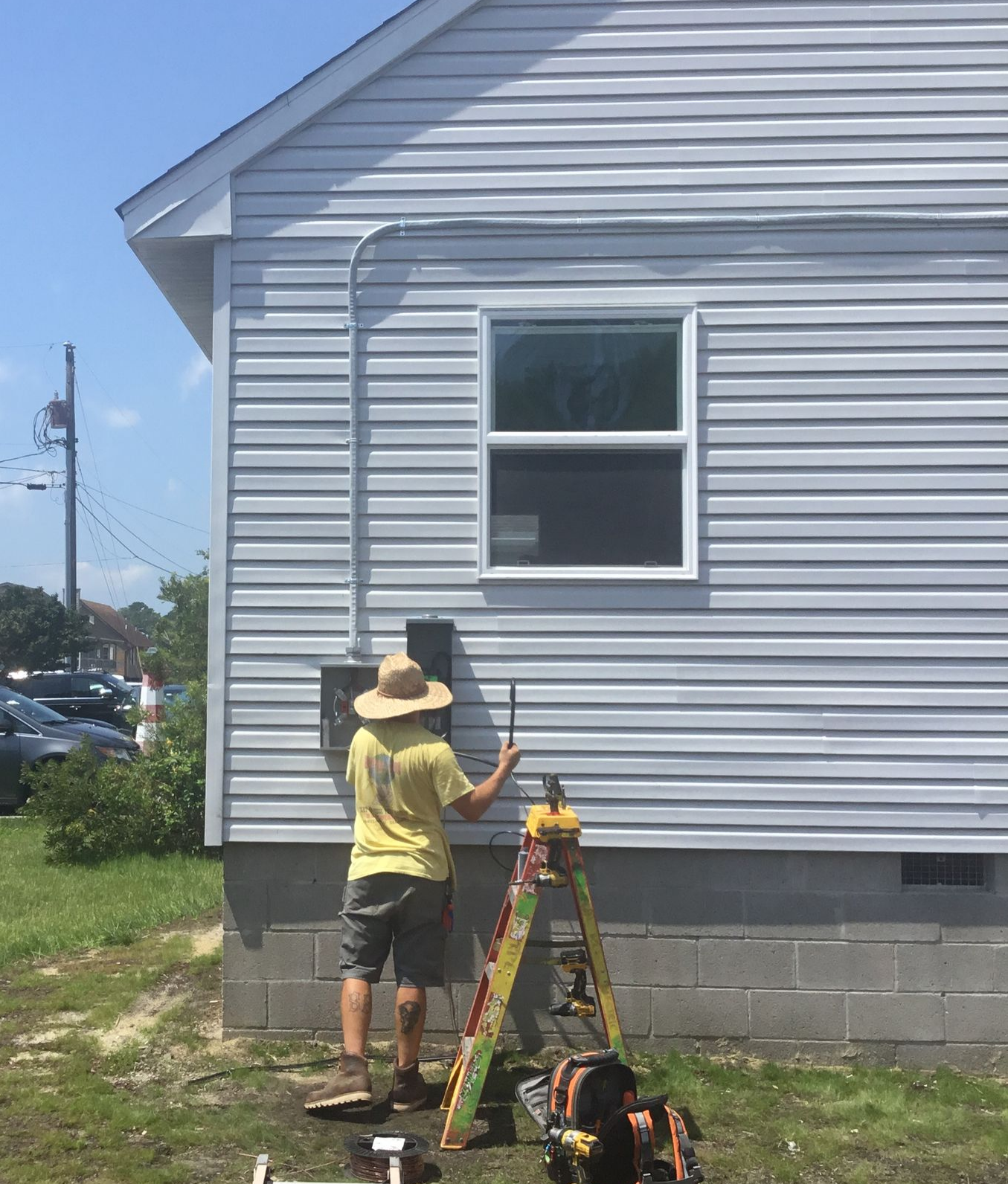 Electrician Clipping Electrical Wires — Ocean City, MD — Royal Plus Electric Electrician Clipping Electrical Wires — Ocean City, MD — Royal Plus Electric