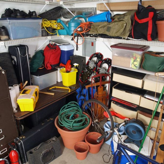 A garage filled with lots of items including a bicycle