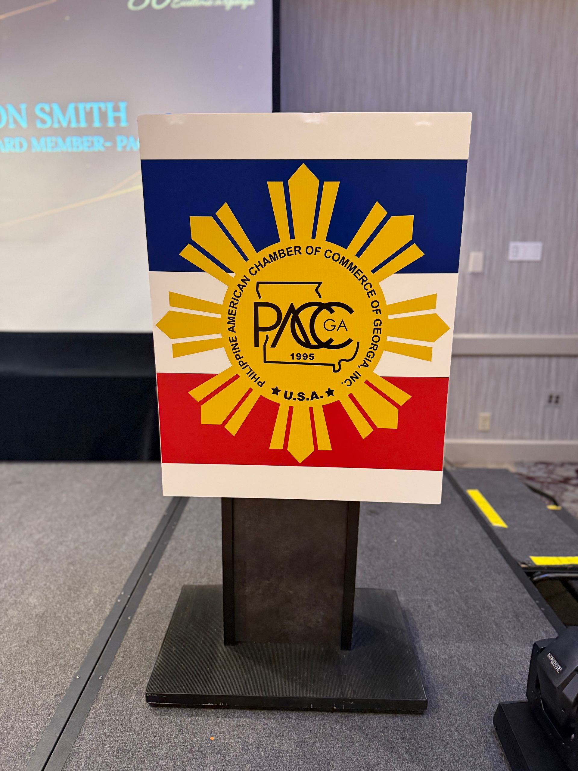 Podium with the Philippine flag and PACGA logo.