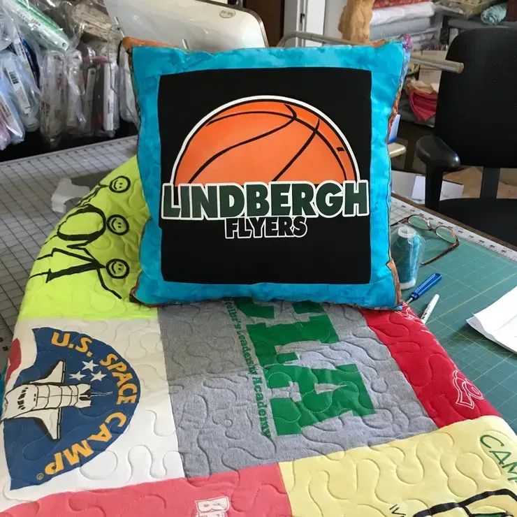 A blue pillow with a basketball and
