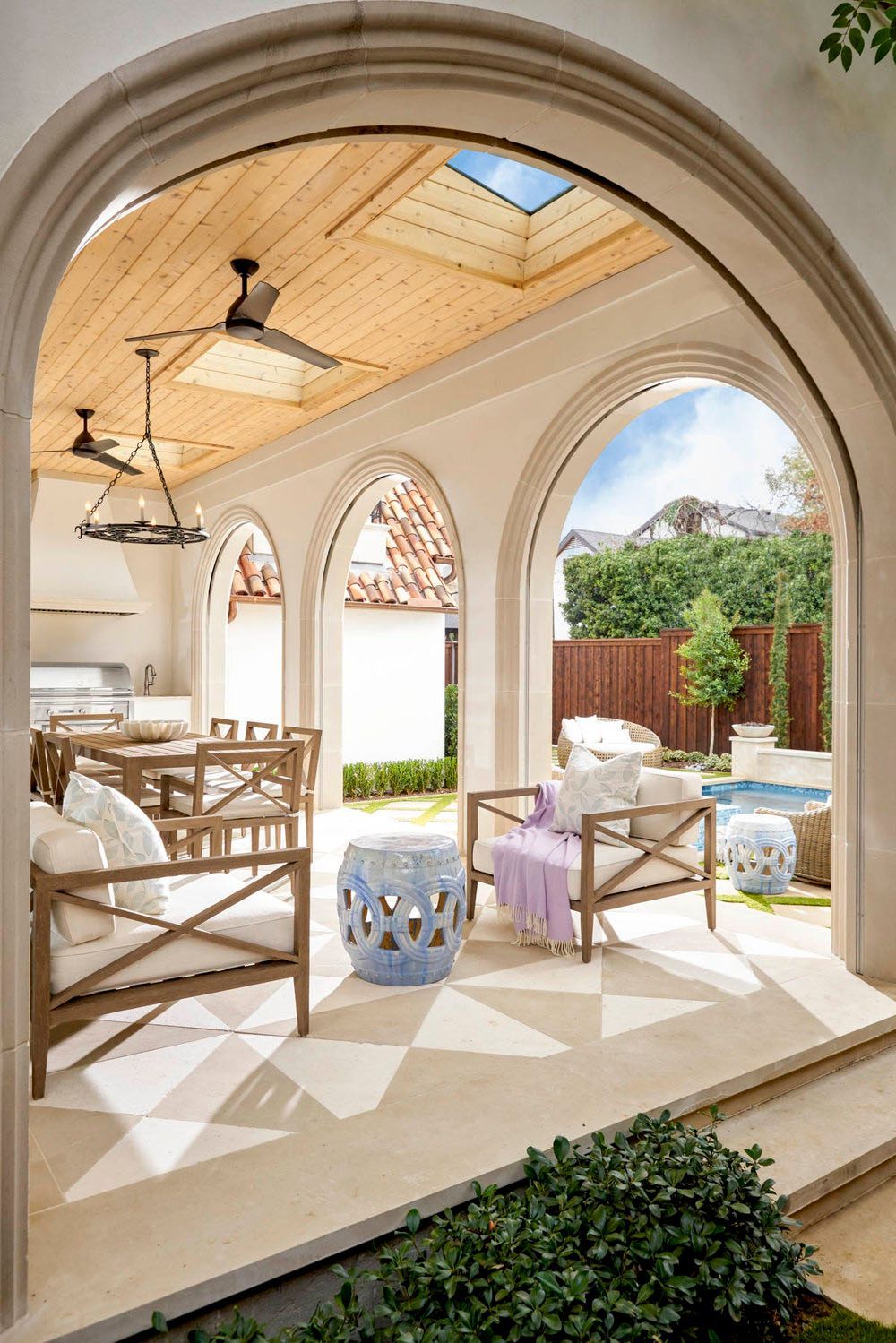A patio with a ceiling fan and a skylight.