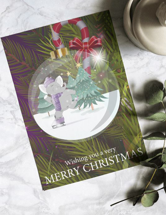 A christmas card with an elephant holding a christmas tree in a snow globe.