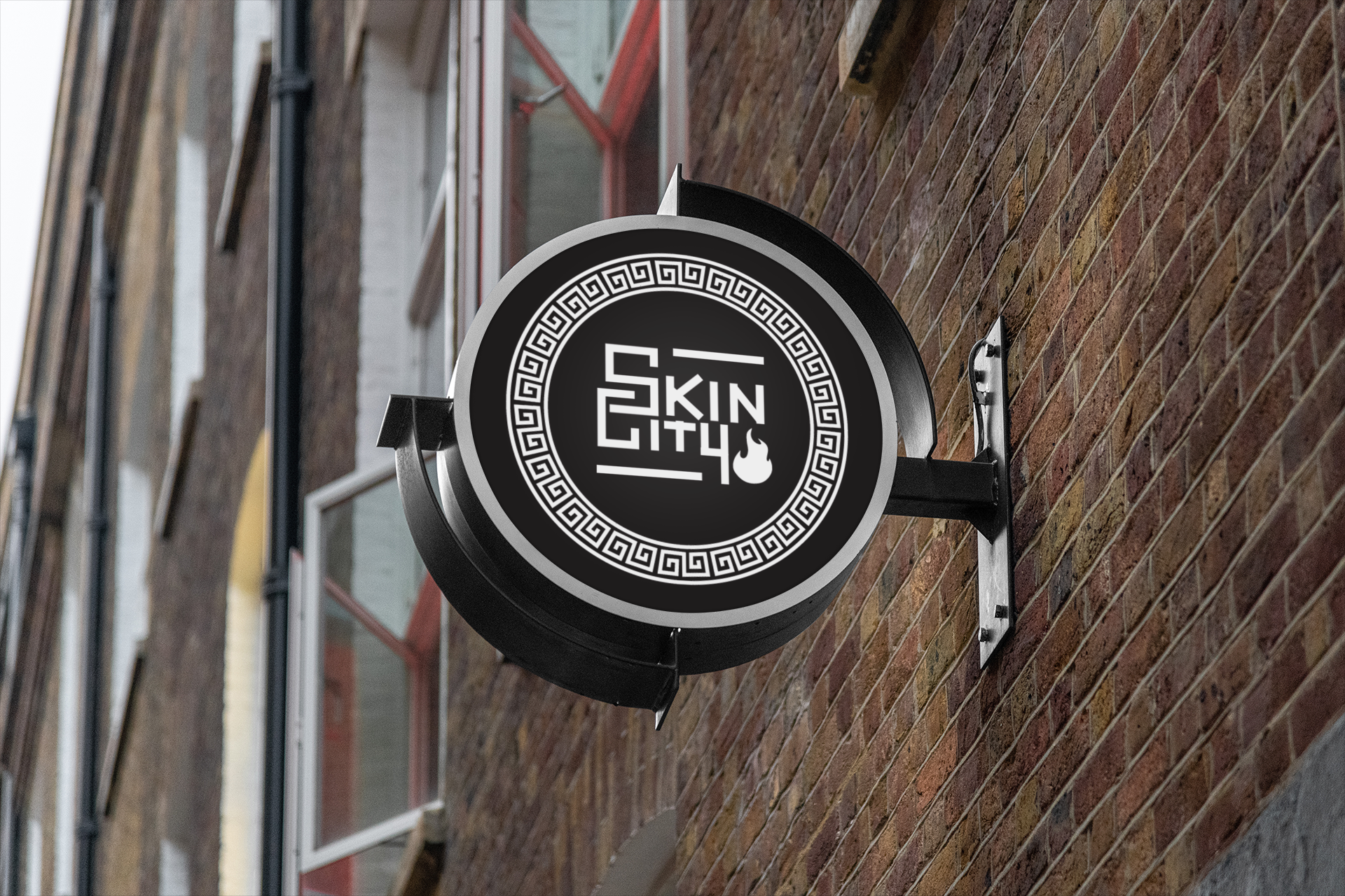 A sign on the side of a building that says skin city