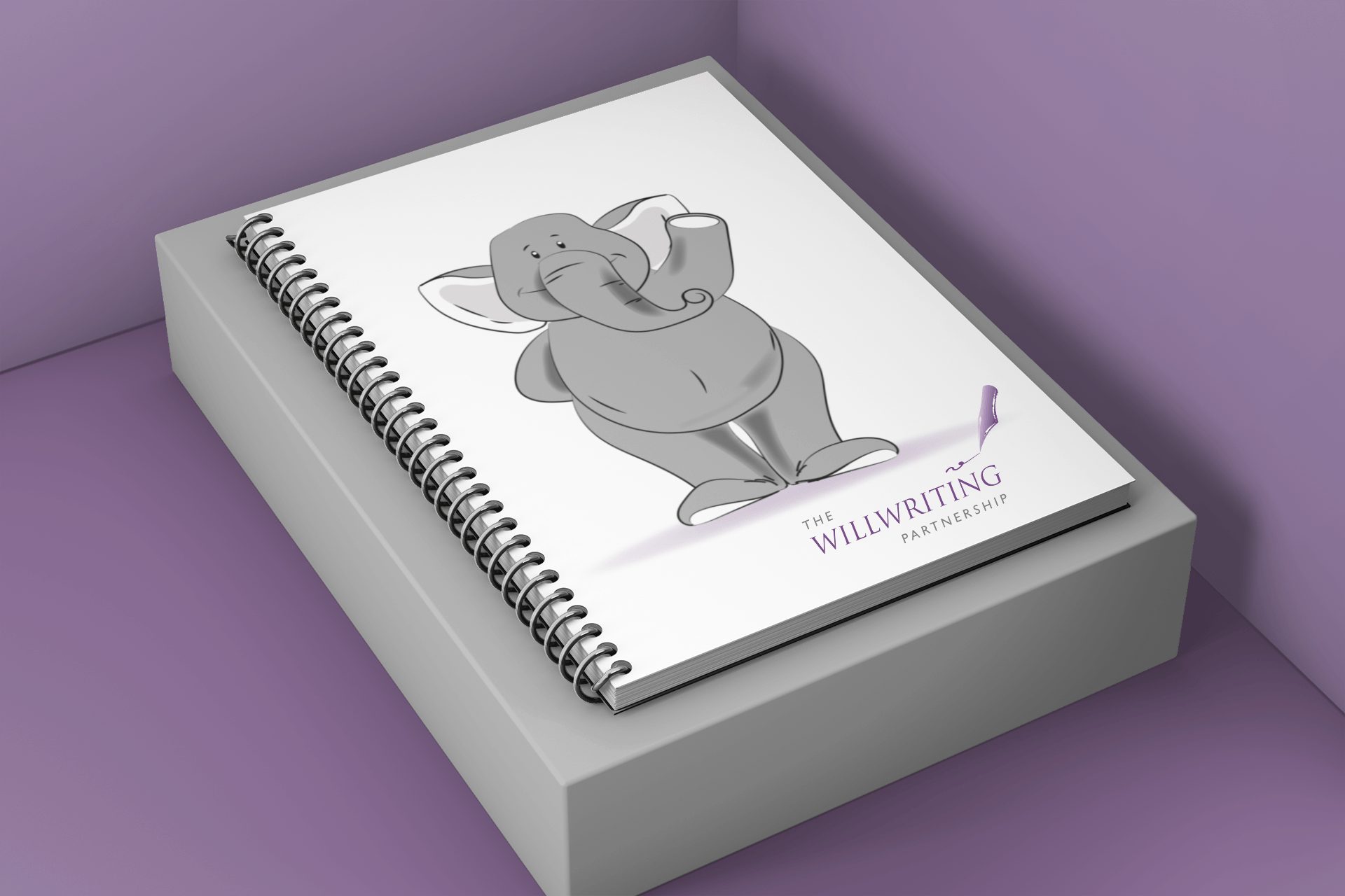 A spiral notebook with a drawing of an elephant on it