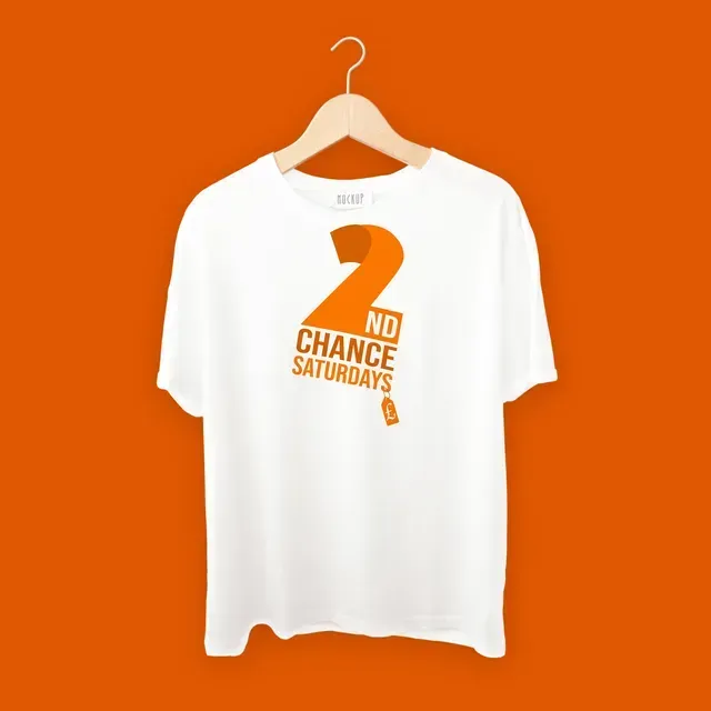 A white shirt that says no chance saturdays hangs on a hanger