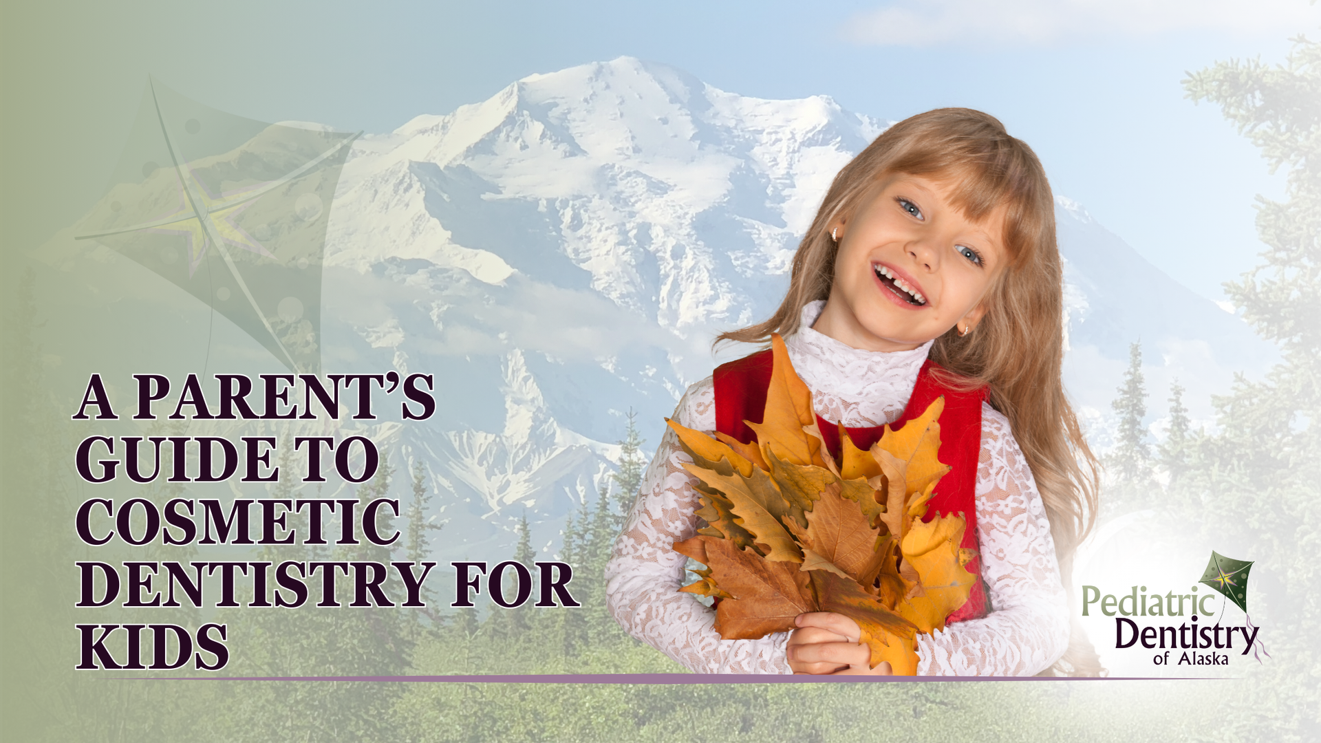 A little girl is holding a bunch of leaves in front of a mountain.