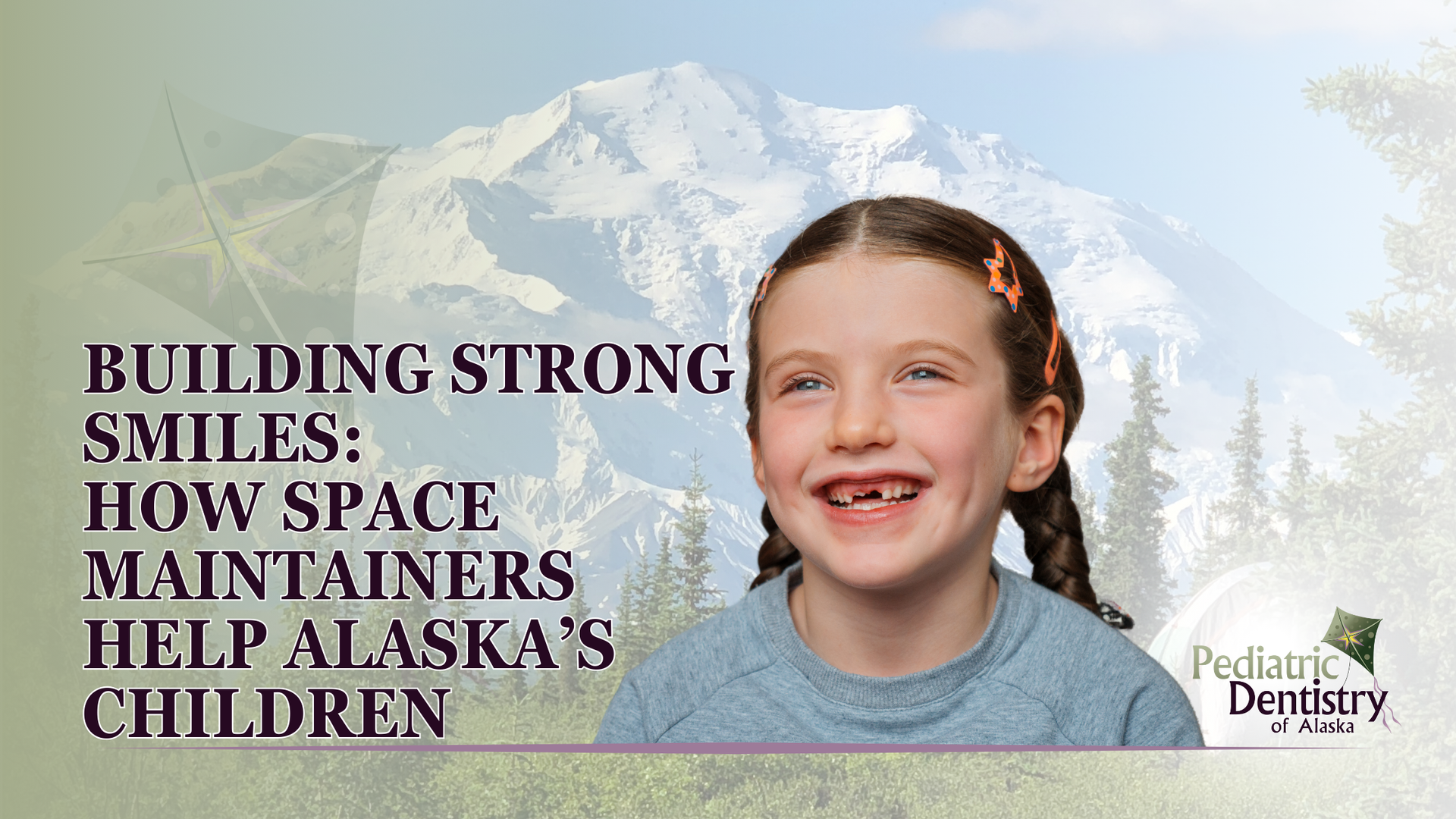 A little girl is smiling with a mountain in the background