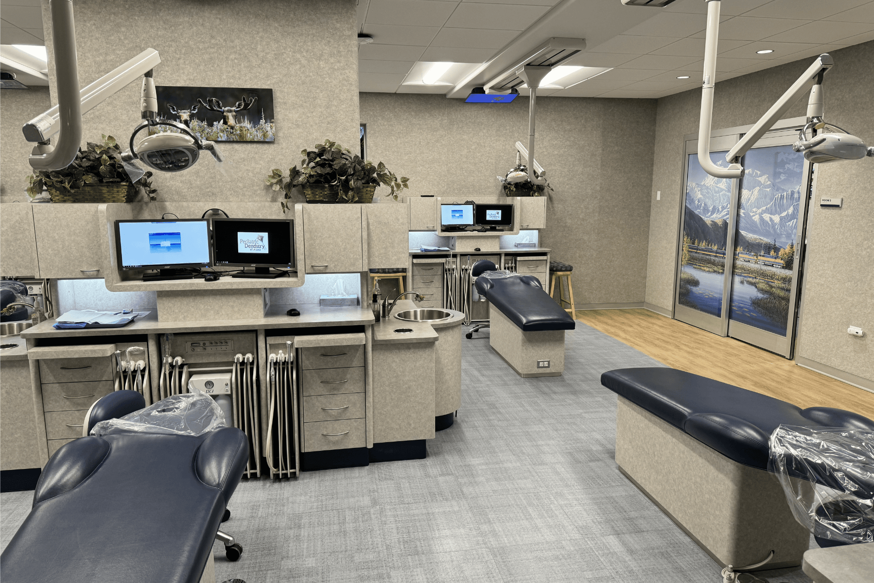 a dental office with a lot of dental chairs and computers | Pediatric Dentistry of Alaska | Best Pediatric Dentist In Wasilla and Palmer, Alaska