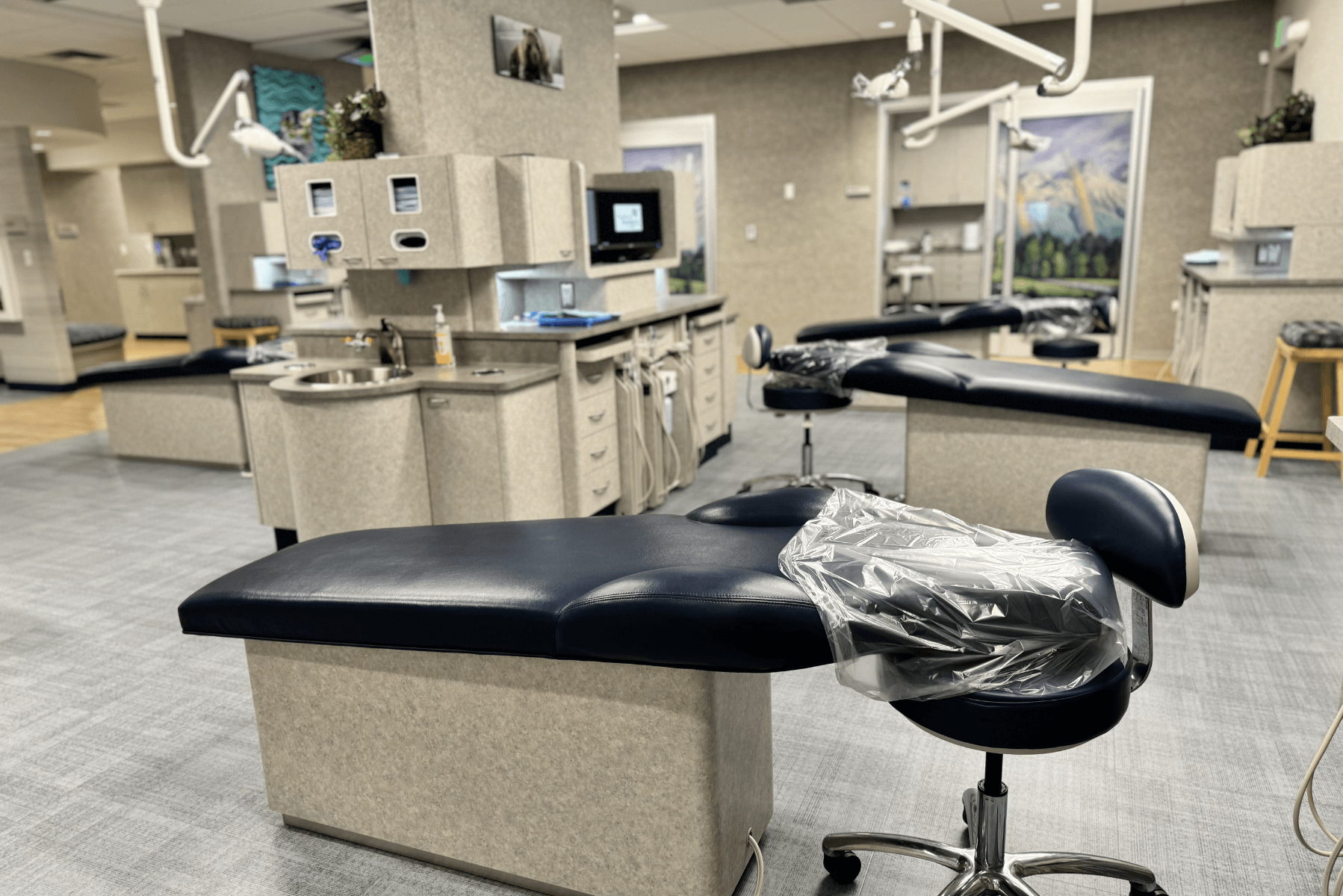 a dental office with a dental chair in the middle of the room | Pediatric Dentistry of Alaska | Best Pediatric Dentist In Wasilla and Palmer, Alaska
