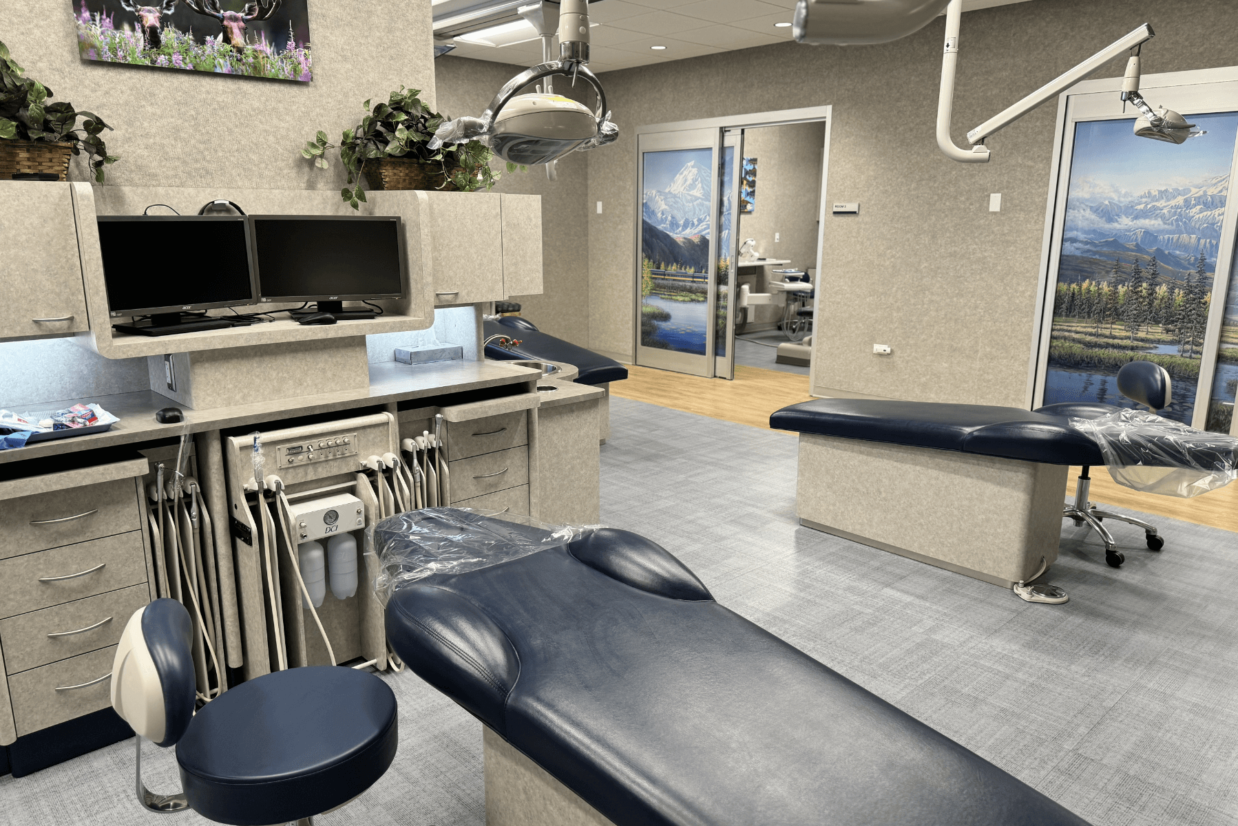 a dental office with a dental chair and a stool | Pediatric Dentistry of Alaska | Best Pediatric Dentist In Wasilla and Palmer, Alaska