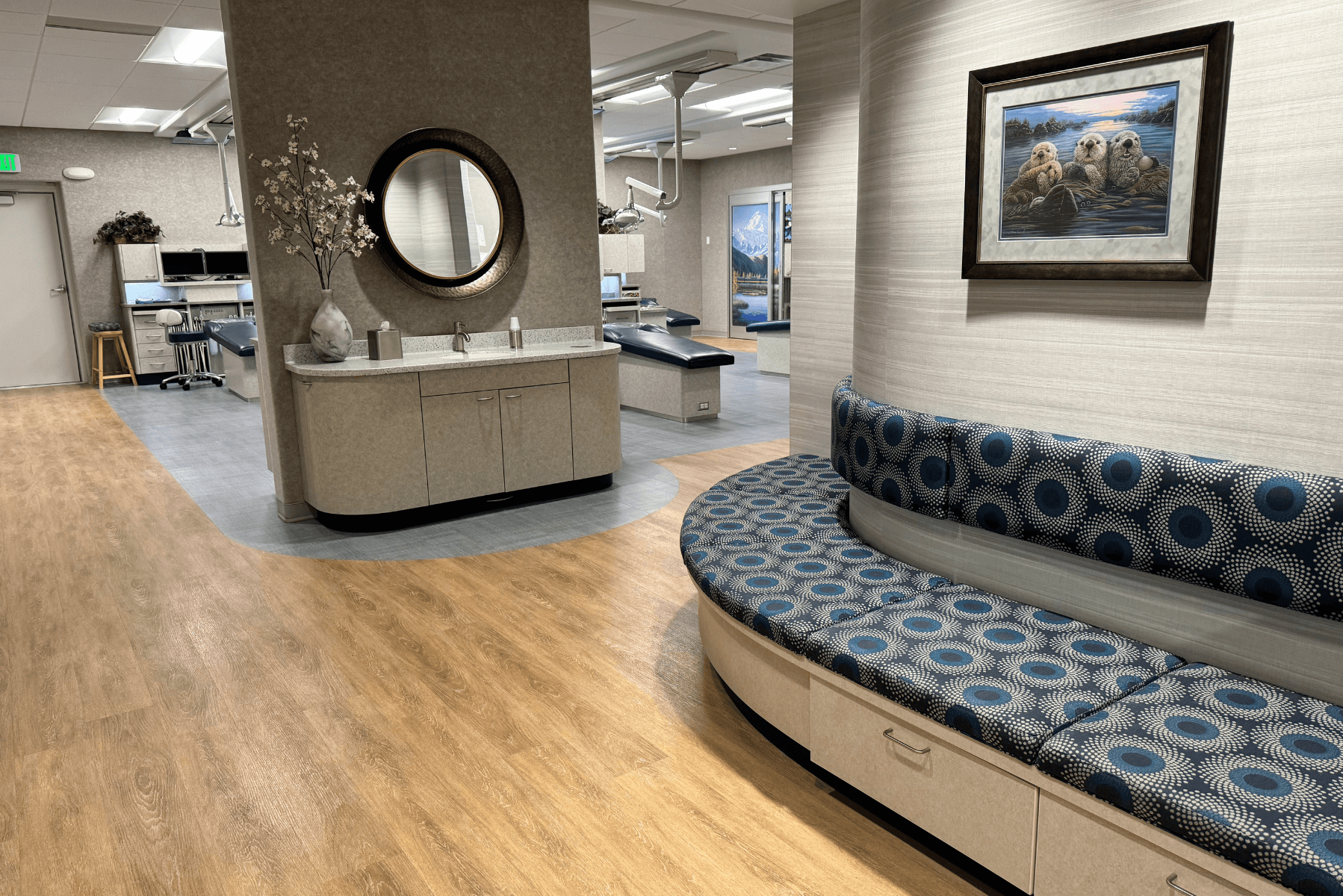 a dental office with a couch and a mirror on the wall | Pediatric Dentistry of Alaska | Best Pediatric Dentist In Wasilla and Palmer, Alaska