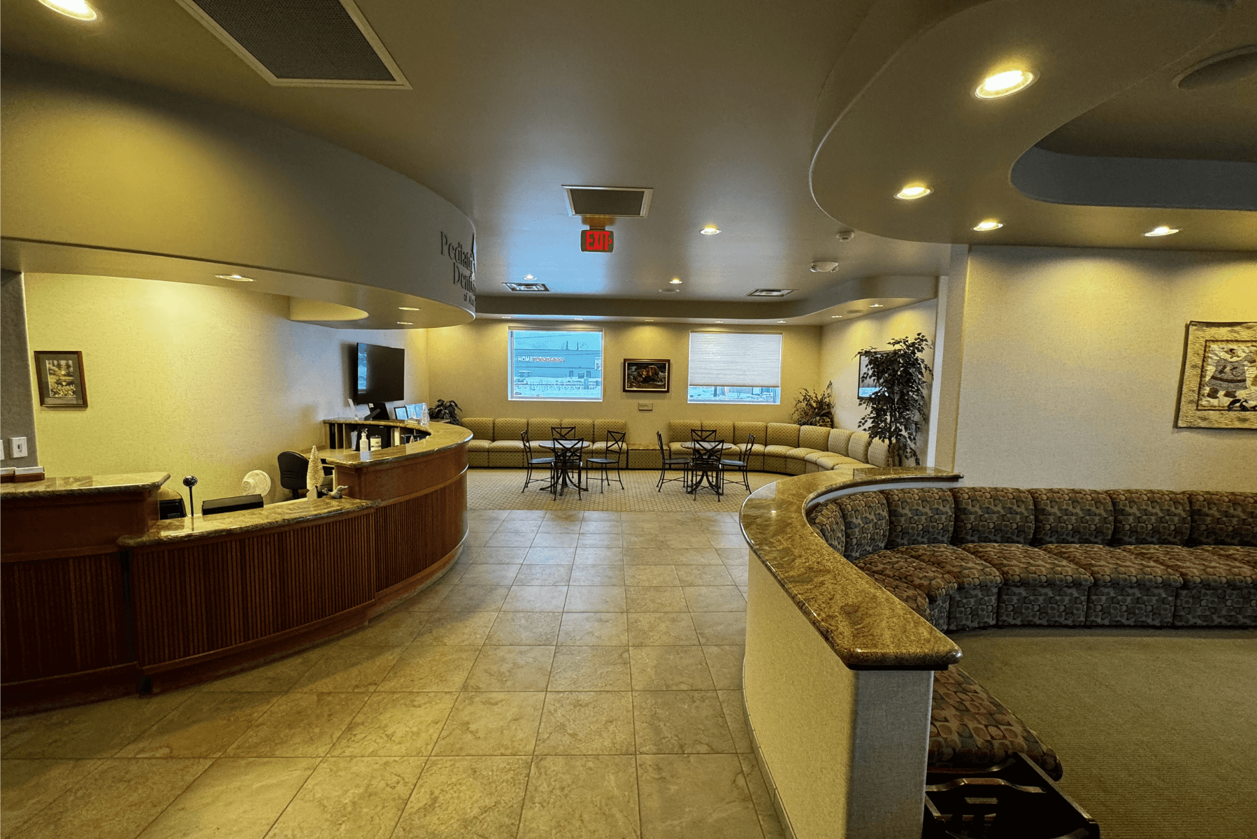 a waiting room with a couch and a counter in a hospital | Pediatric Dentistry of Alaska | Best Pediatric Dentist In Wasilla and Palmer, Alaska