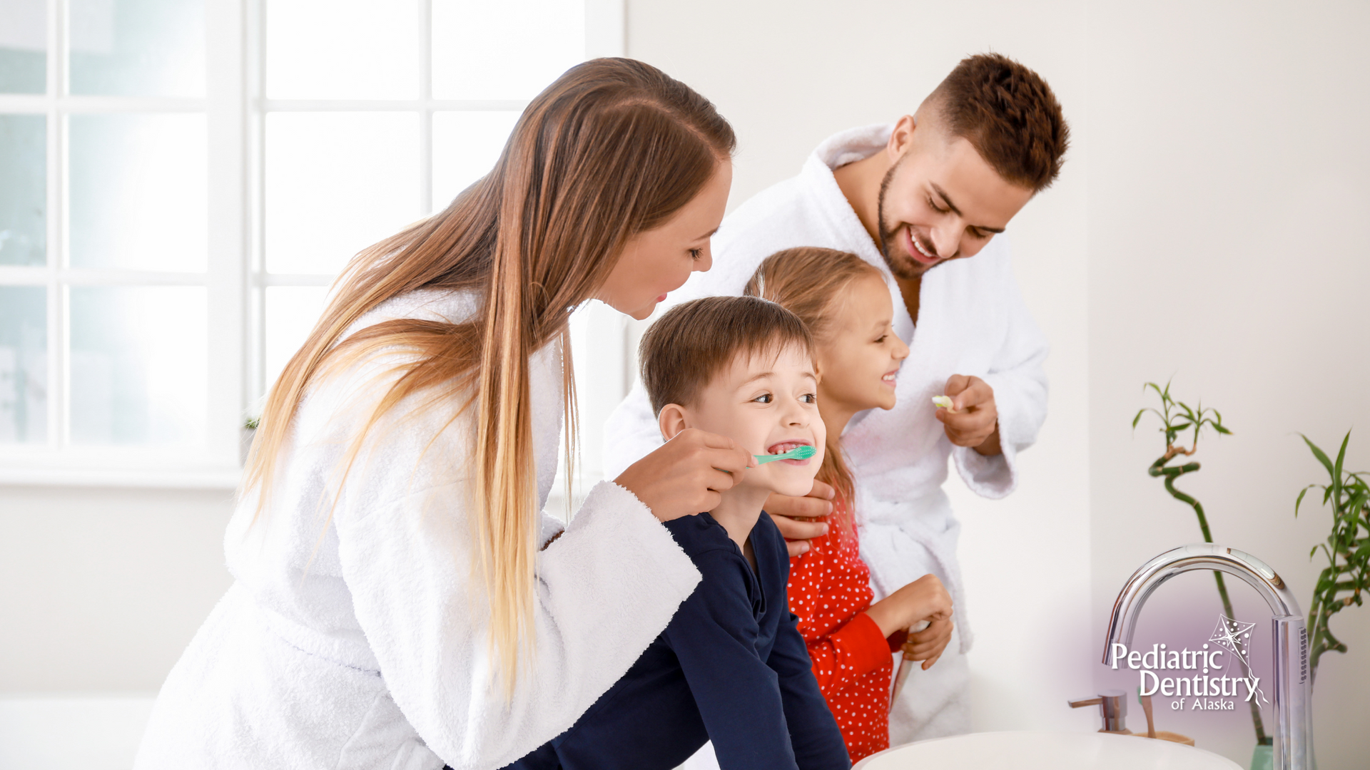 A family is brushing their teeth together in the bathroom.