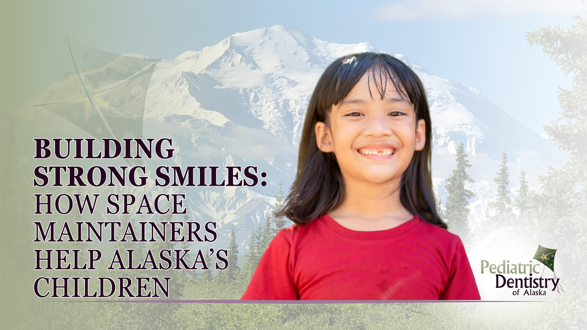 A little girl is smiling with a mountain in the background