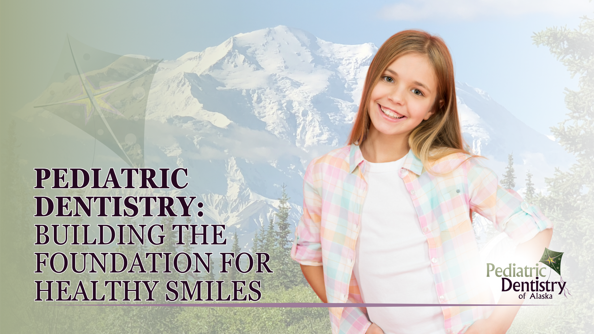 A young girl is smiling in front of a mountain.