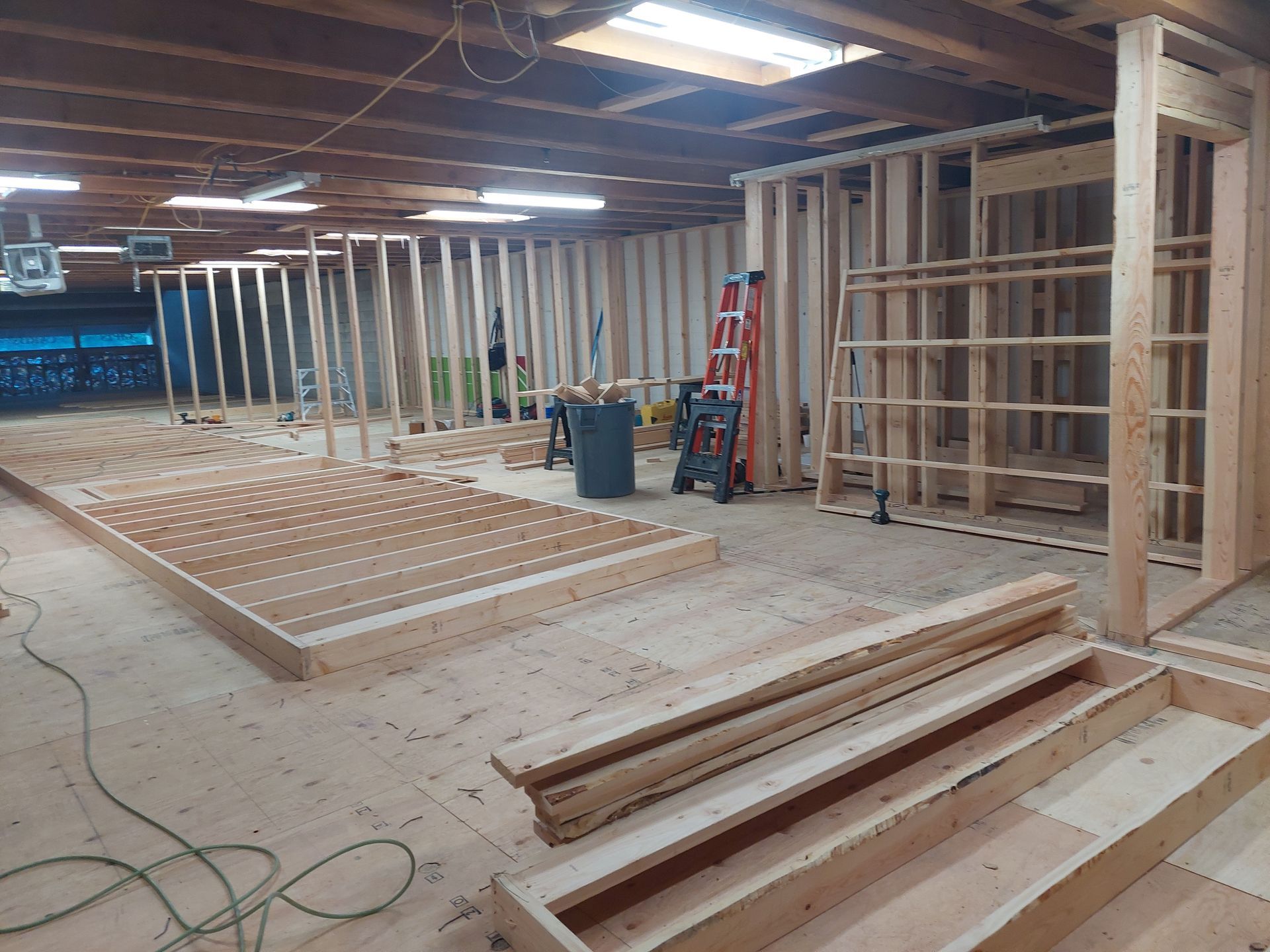 A room filled with wooden frames and a ladder.